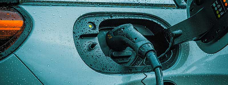 Photo of EV charger connected to an EV