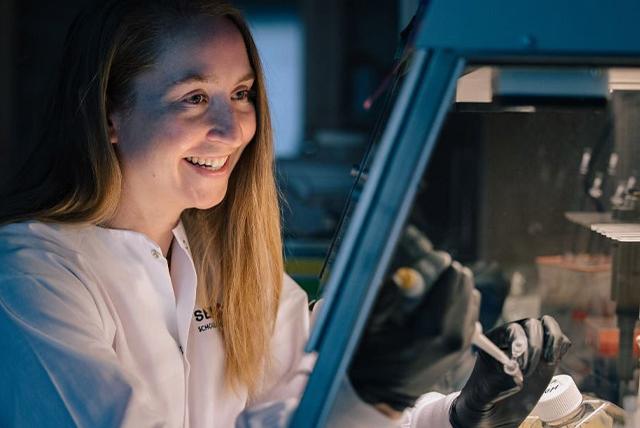 Dr. Anna Blakney in lab gear.