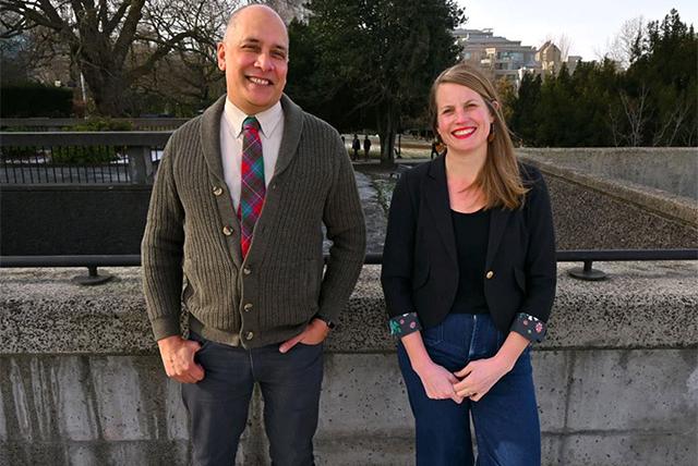 Two people standing next to each other