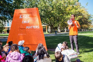 Danilo Caron speaking at a 2019 Orange Shirt Day event.