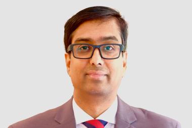 Professor Bhushan Gopaluni poses in front of a white background