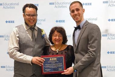 Andrew Jamison and Adam Cornford receive the Vice President’s Recognition Award from Dr. Rabab Ward on behalf of Geering Up.