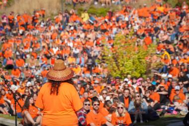 Dana-Lyn addresses the crowd gathered outside the IRSHDC on Orange Shirt Day.