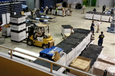Boxes in a warehouse with a forklift operating