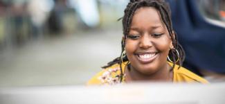Woman sitting in front of a computer