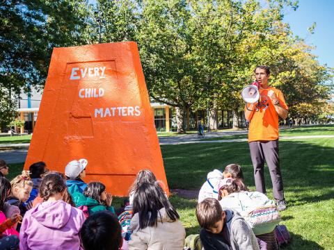 Danilo Caron speaking at a 2019 Orange Shirt Day event.