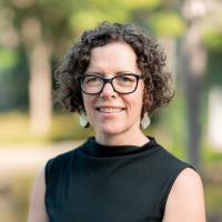 Woman outside among trees