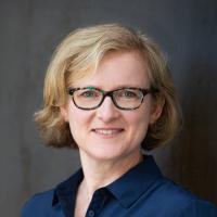 Woman in front of backdrop